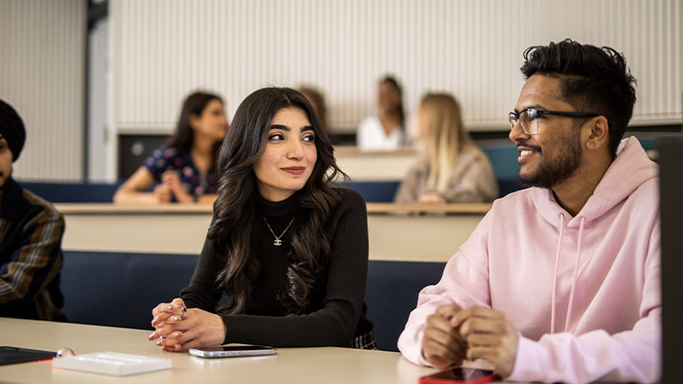 Two people attending a lesson